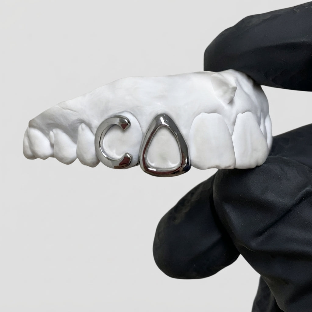 "C" and pyramid grillz